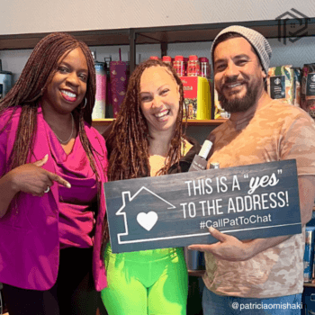 Happy first-time homebuyers celebrating their new home with their smiling realtor who helped make their dream a reality. Holding a sign that says 'This is a YES to the address!' #CallPatToChat